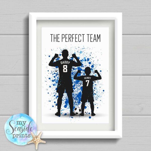 This print has a silhouette of a father and son dressed in their football kits and their shirt is personalised with any name and number of your choice.